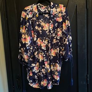 Multi color cover up. Tasseled sleeves.